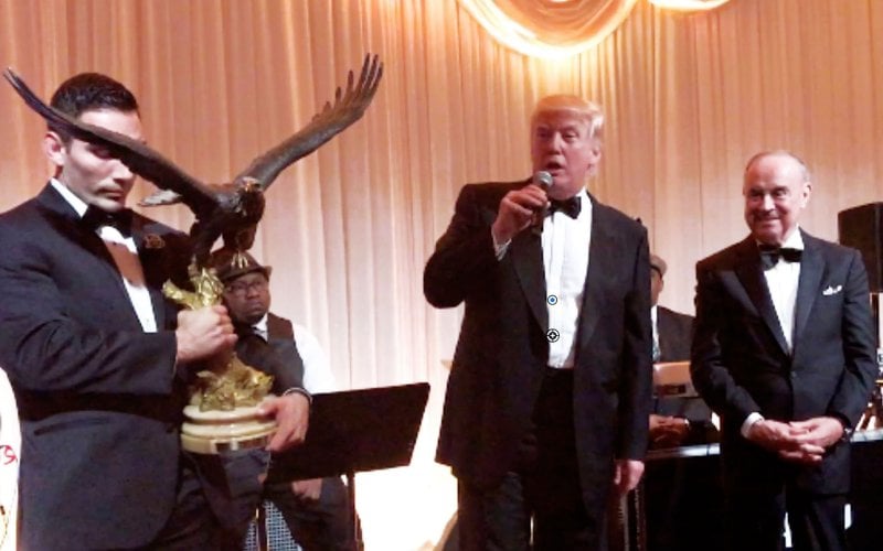 Donald Trump receiving an award from Joseph 