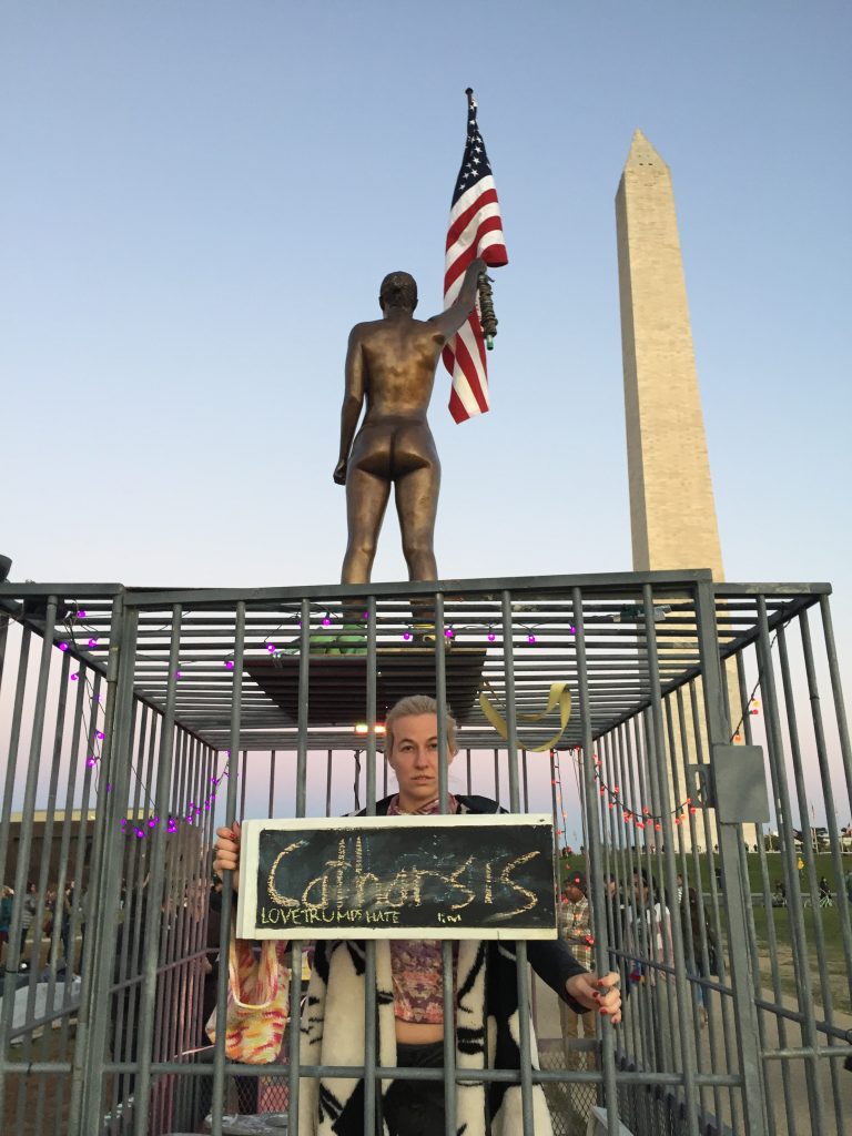 Natalie White in "Women's Equality Jail" on the Washington Mall, with her statue <em>Sister of Liberty</em> at Catharthis on the Mall in November 2016. Courtesy of Natalie White for Equal Rights.