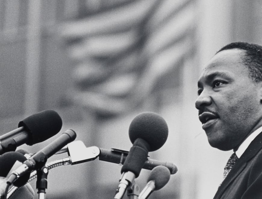 View of Dr. Martin Luther King, Jr. addressing a crowd gathered outside the United Nations following a march from Central Park on April 15, 1967. In his speech, Dr. King decried the Vietnam War as a racist war. Courtesy of the Museum of the City of New York.