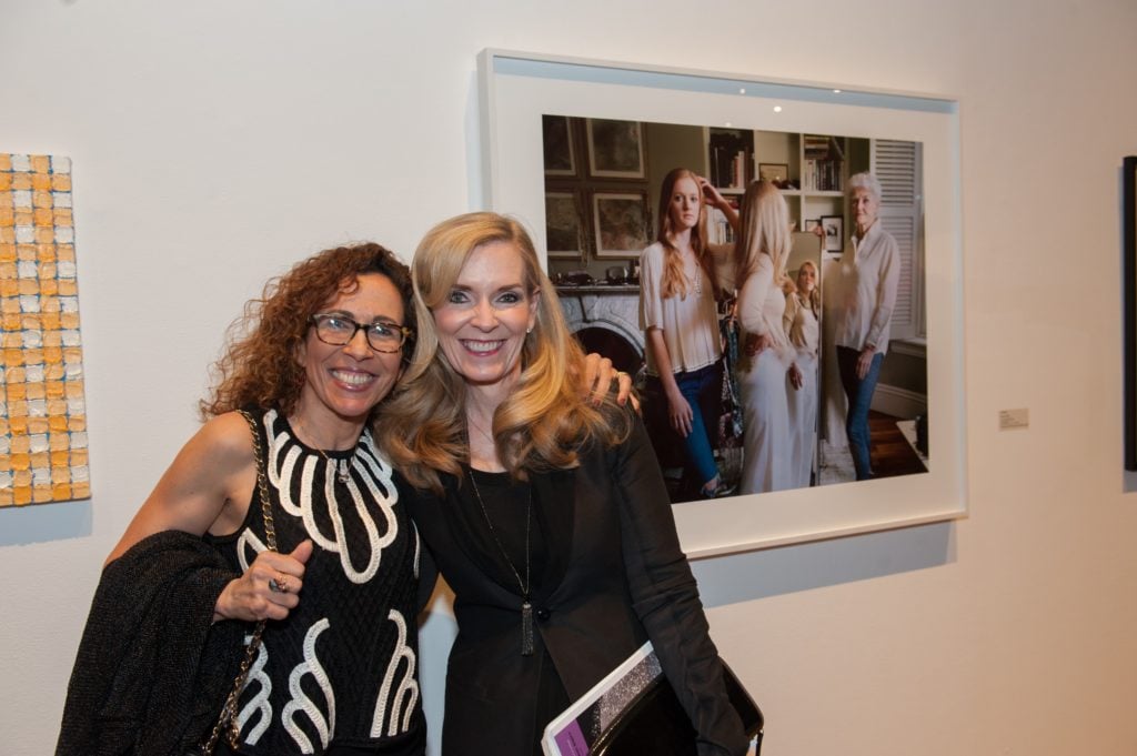 Rania Matar (MassArt faculty and auction artist) and Elizabeth Lowrey in front of Matar's live auction piece featuring Lowrey. Courtesy of MassArt. 