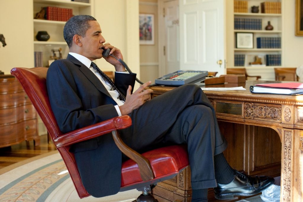 Barak Obama on the phone in the Oval Office. Photo Universal History Archive/UIG via Getty Images.