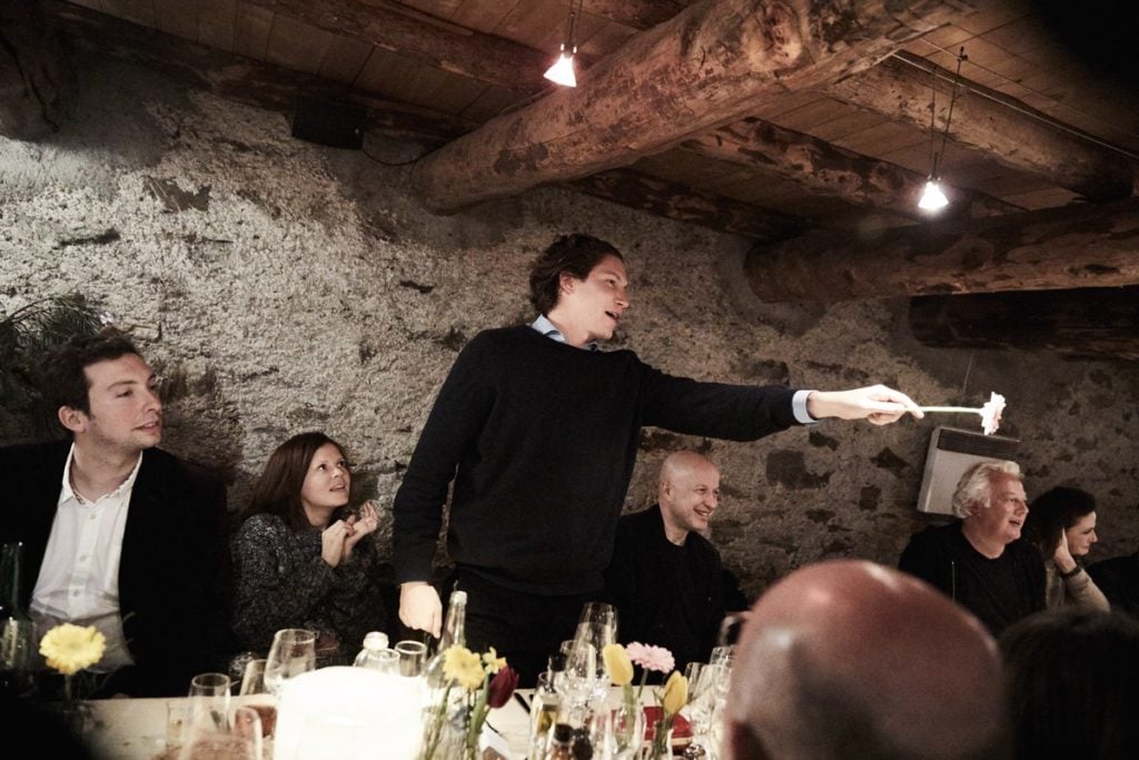 Vito Schnabel giving a toast at the opening dinner for a show curated by Bob Colacello. Photo by Micha Freutel/Torvioll Jashari. Courtesy Vito Schnabel Gallery, St. Moritz.