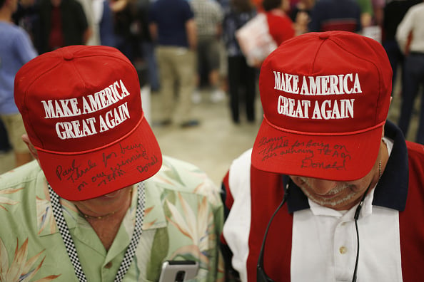 Attendees wear hats in support of Donald Trump, president and chief executive of Trump Organization Inc. and 2016 Republican presidential candidate, not pictured, during a campaign event in Indianapolis, Indiana, U.S., on Wednesday, April 20, 2016. Photo by Luke Sharrett/Bloomberg via Getty Images