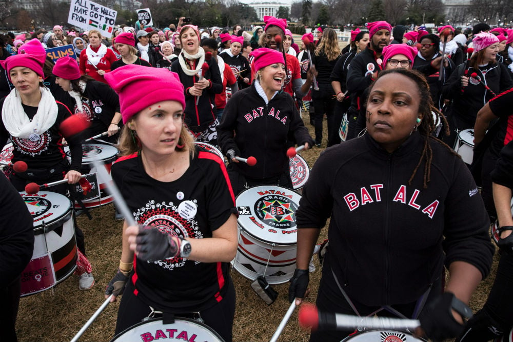 A group of demonstrators play drums during the Women's March on Washington January 21, 2017 in Washington, DC. Photo credit should read Zach Gibson/AFP/Getty Images.