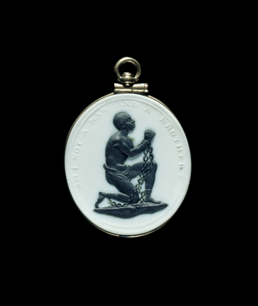 Josiah Wedgwood, <em>Slave-in-Chains</em> medallion Wedgwood Manufactory (Staffordshire, England), 1786–87, stoneware (Jasperware), basalt, gold. Bequest of Mrs. Richard Baker. Courtesy of the Museum of Fine Arts, Boston.