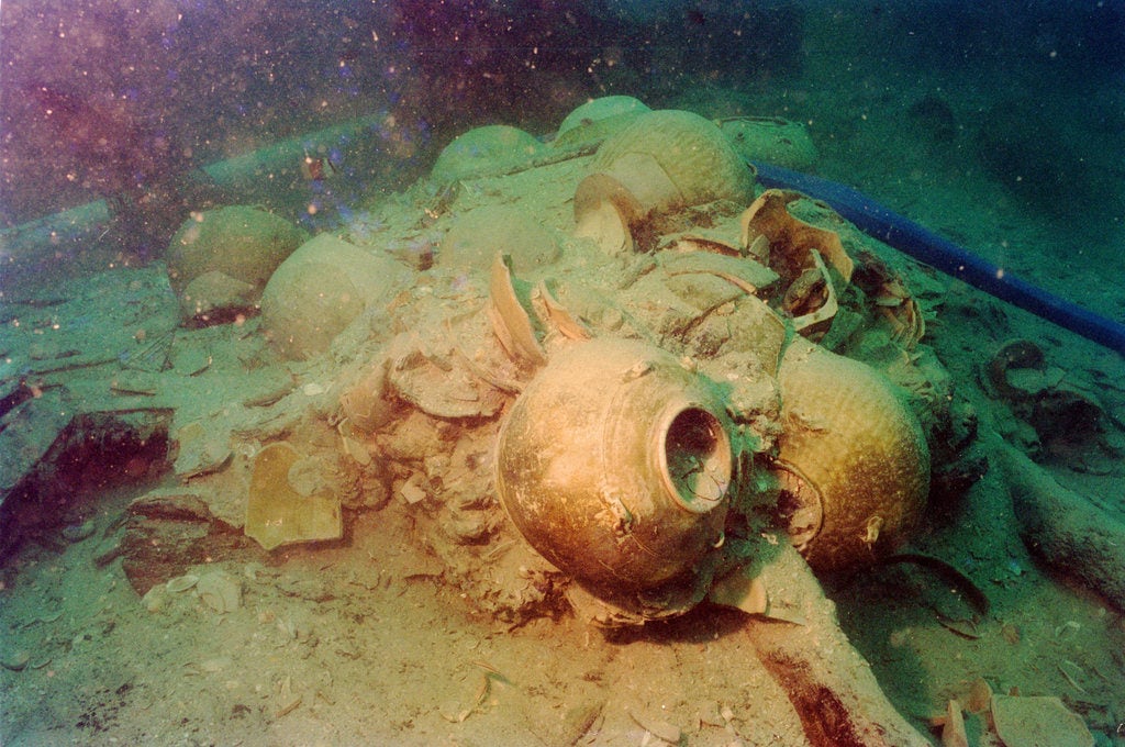 The wreckage of a ninth-century Chinese ship in 1998, when it was discovered by divers off the coast of Indonesia. Courtesy of Michael Flecker/the Asia Society.