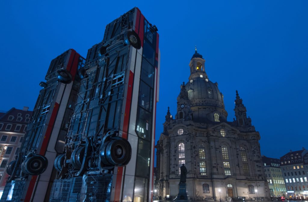Manaf Halbouni, Monument in Dresden. The Syrian-German artist hopes the sculpture will help bridge the gap between Dresden and Aleppo. Courtesy of Robert Michael/AFP/Getty Images.