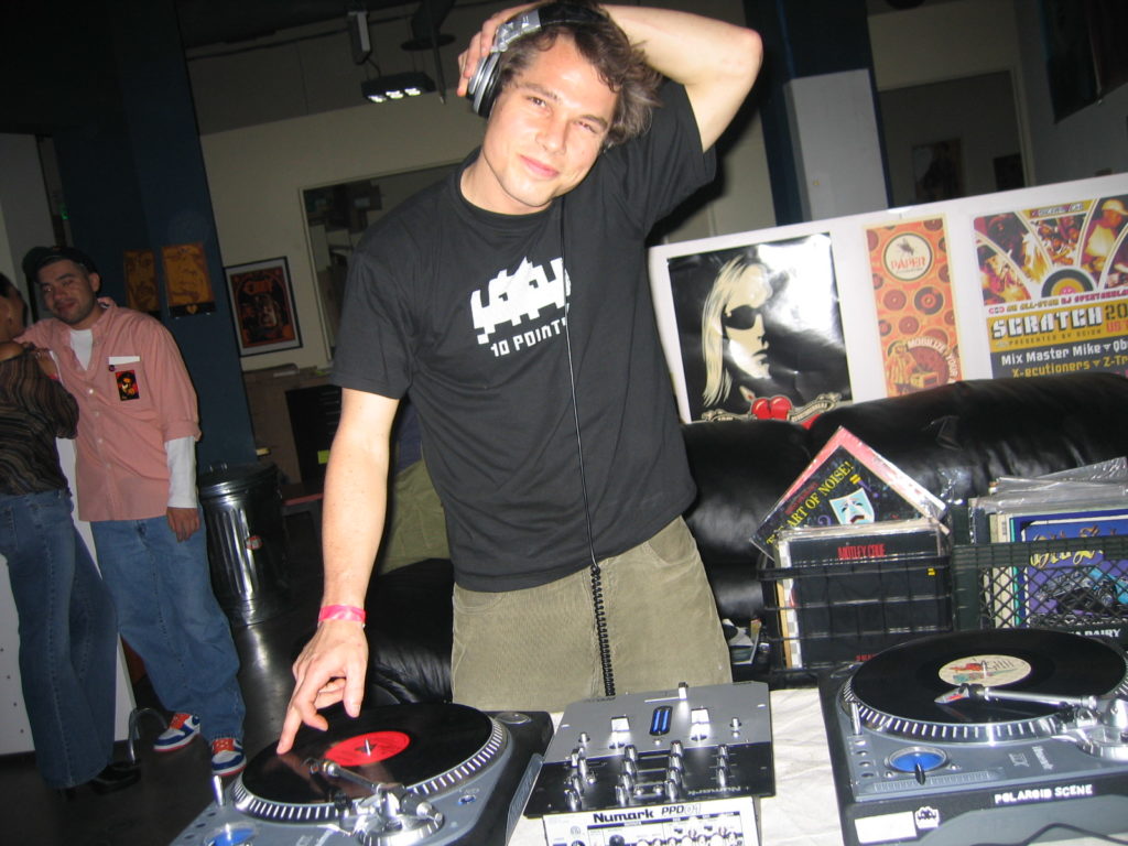 Shepard Fairey DJing at an opening at Subliminal. Courtesy of Mark Hunter AKA the Cobrasnake.