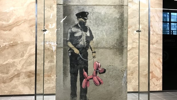 Banksy Man with Baloon Dog . Screenshot taken from @adriancheungCBC