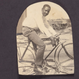 Picture of a man on sitting on a bicycle (circa 1920s). Courtesy of the Loewentheil Collection of African-American Photographs, Cornell University Library.