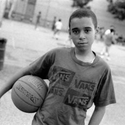 Robert Gerhardt, Young Basketball Player in the Park before Friday Prayers, Brooklyn, NY (2011). Courtesy of the Museum of the City of New York.