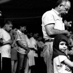 Robert Gerhardt, Young Girl at Prayers with Her Father, Muslim American Society, Brooklyn, NY (2010). Courtesy of the Museum of the City of New York.