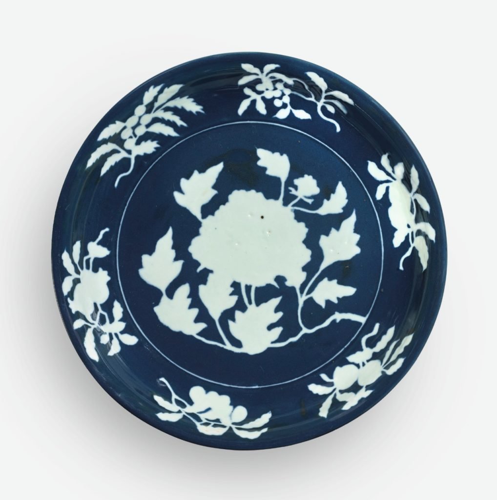 An Exceptionally Rare and Large Fine Blue and White Reserve-Decorated "Peony" Dish. Xuande mark and period. Pre-sale estimate $1–1.5 million. Courtesy of Sotheby's.