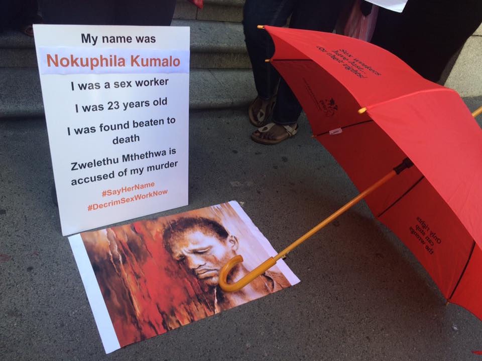 A portrait of murder victim Nokuphila Kumalo outside the courthouse, part of SWEAT's #SayHerName campaign
