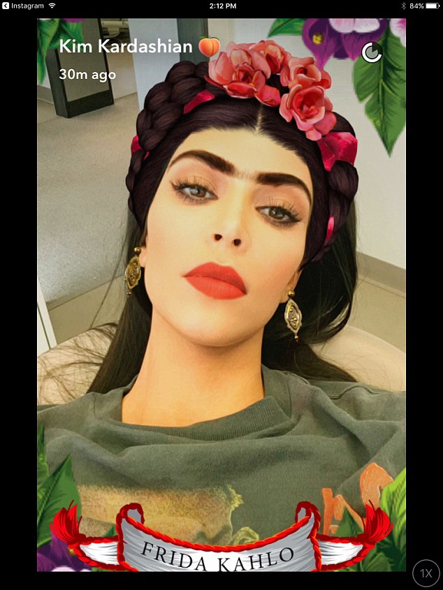 Kim Kardashian using the Snapchat Frida Kahlo filter created for International Women's Day. Courtesy of Kim Kardashian. 