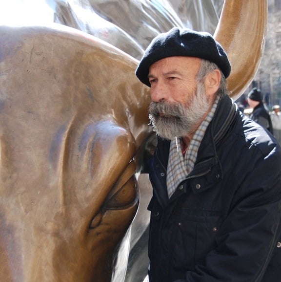Arturo Di Modica with Charging Bull. Photo courtesy of Geist MC.