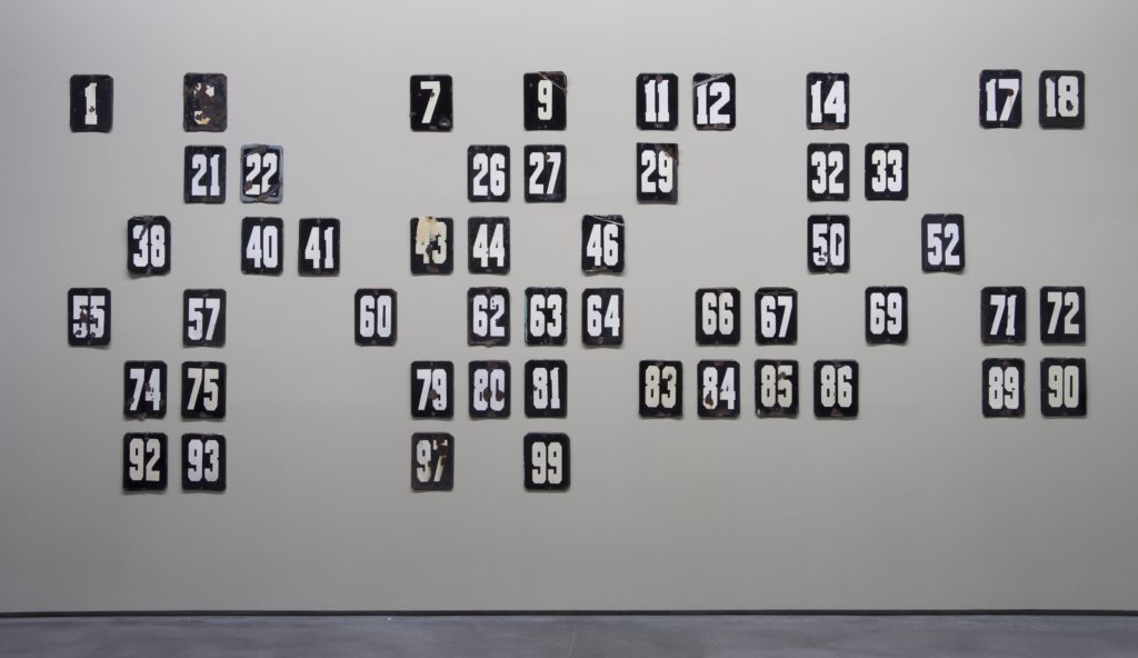 Aslan Gaisumov Numbers (2015) 50 metal plaques, overall dimensions 203 × 479 cm Courtesy of the artist and Galerie Zink, Waldkirchen