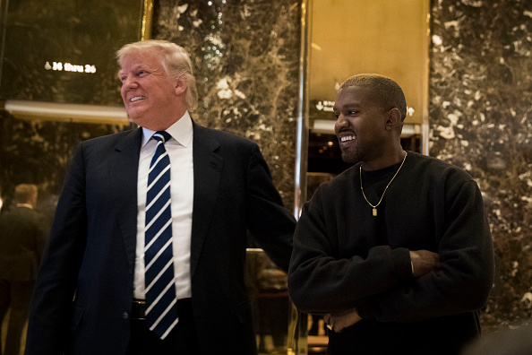President-elect Donald Trump and Kanye West stand together in the lobby at Trump Tower, December 13, 2016 in New York City. Photo by Drew Angerer/Getty Images.