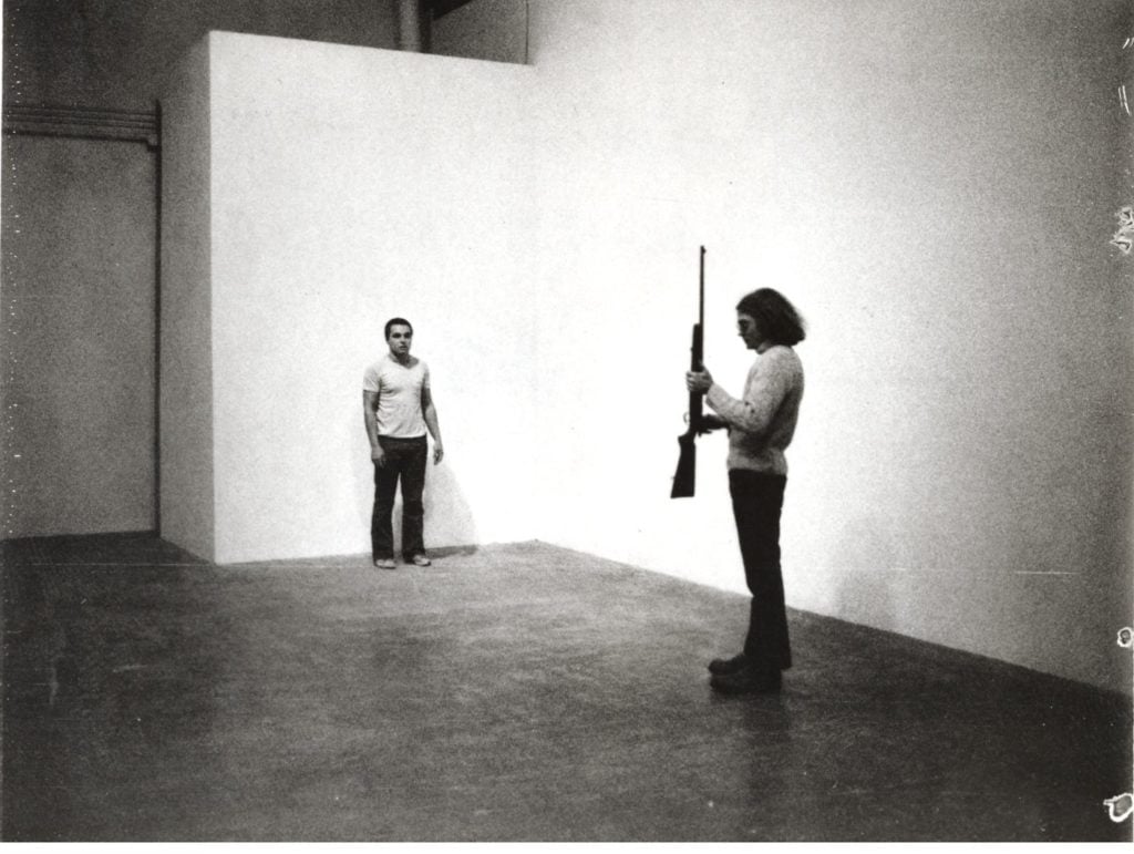 A still from the new documentary <i>Burden</i> (2016), showing the artist performing <i>Shoot</i> (1971). Courtesy Magnolia Pictures.