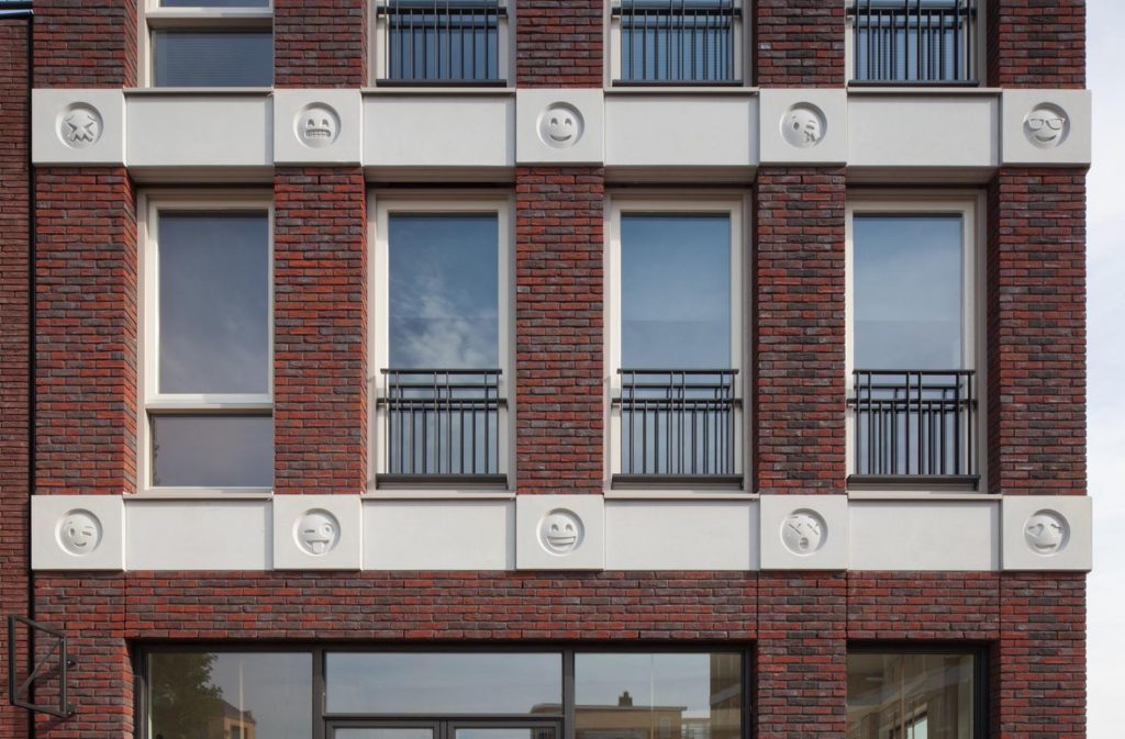 Emoji on a building by Attika Architekten. Courtesy Attika Architekten/photographer Bart van Hoek.