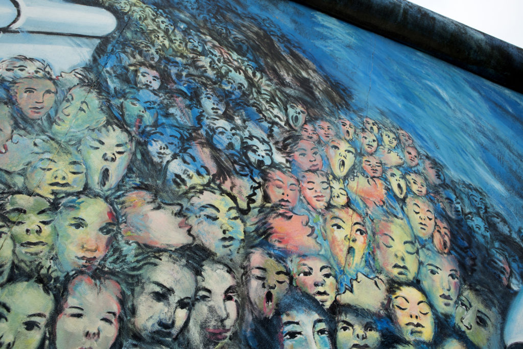 Detail of Kani Alavi's mural on the Berlin Wall's East Side Gallery. Courtesy Melanie Stetson Freeman/The Christian Science Monitor via Getty Images.