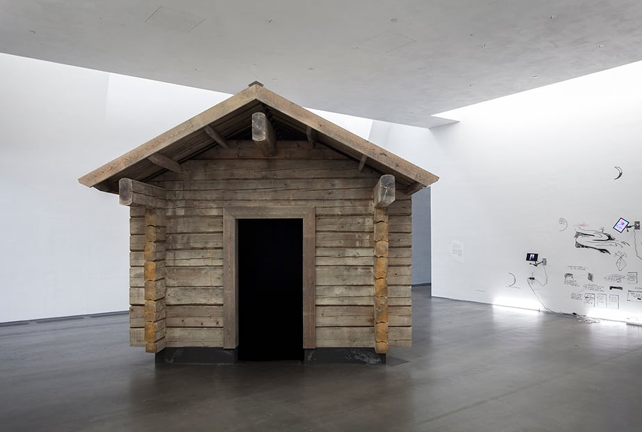 The cabin for <em>#ALONETOGETHER</em> by Shia LaBeouf, Nastja Säde Rönkkö, and Luke Turner at Kiasma, the Finnish National Gallery. Courtesy of Shia LaBeouf, Nastja Säde Rönkkö, and Luke Turner.