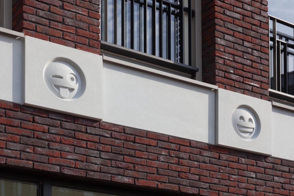 Emoji on a building by Attika Architekten. Courtesy Attika Architekten/photographer Bart van Hoek.