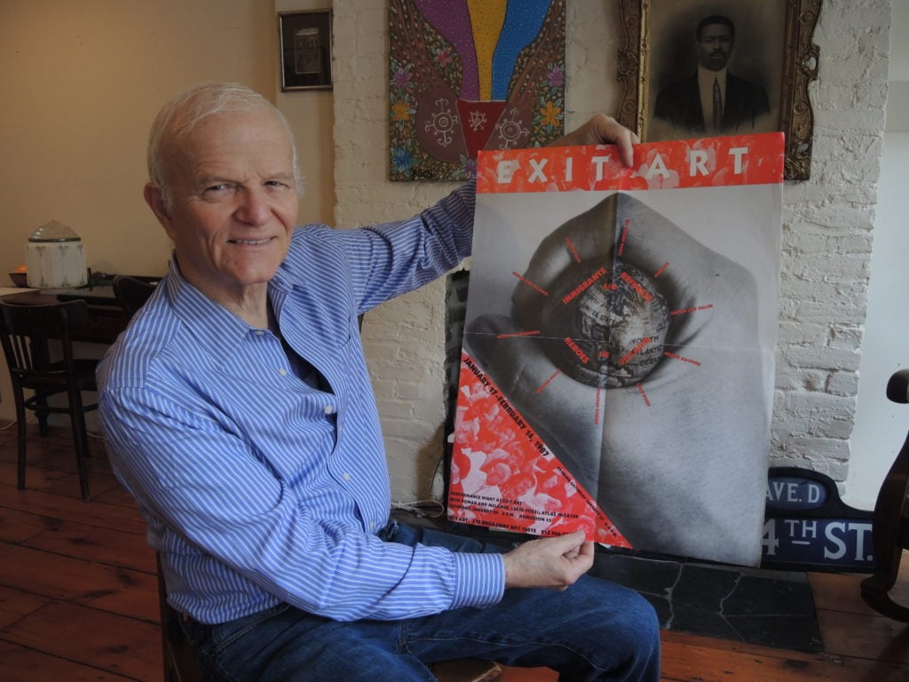 Anton van Dalen with the original poster for the Exit Art show where <em>The Pigeon Car</em> debuted in 1987. Courtesy of Sarah Cascone.