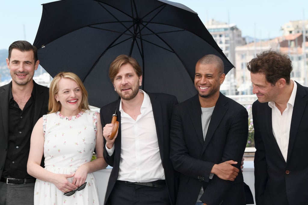 From left to right, Claes Bang, Elisabeth Moss, Ruben Ostlund, Christopher Laesso, and Dominic West attend the The Square photocall during the 70th annual Cannes Film Festival on May 20, 2017. Photo by Matthias Nareyek/Getty Images.
