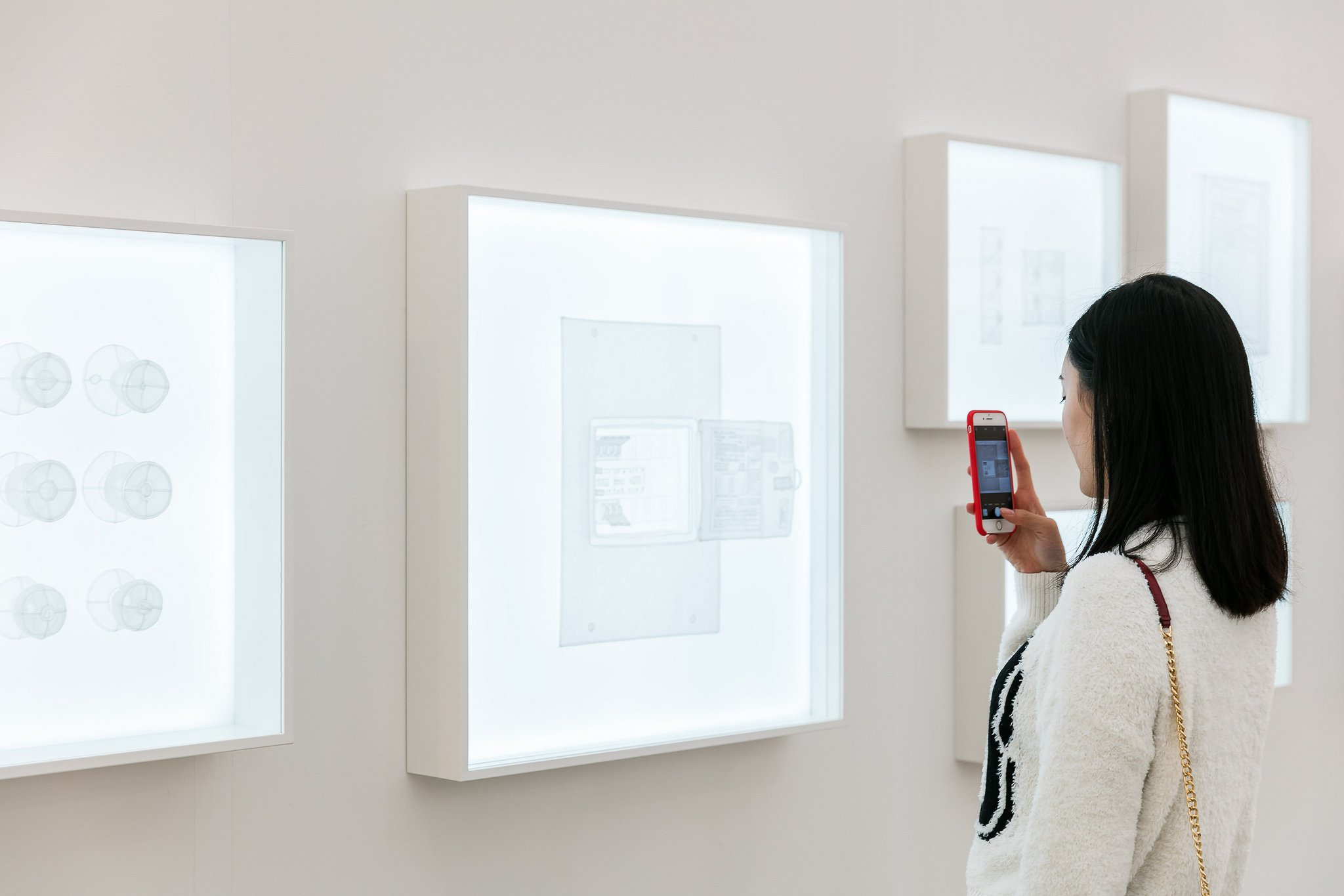 A visitor takes a photograph at Frieze New York. Photograph by Mark Blower. Courtesy of Mark Blower/Frieze