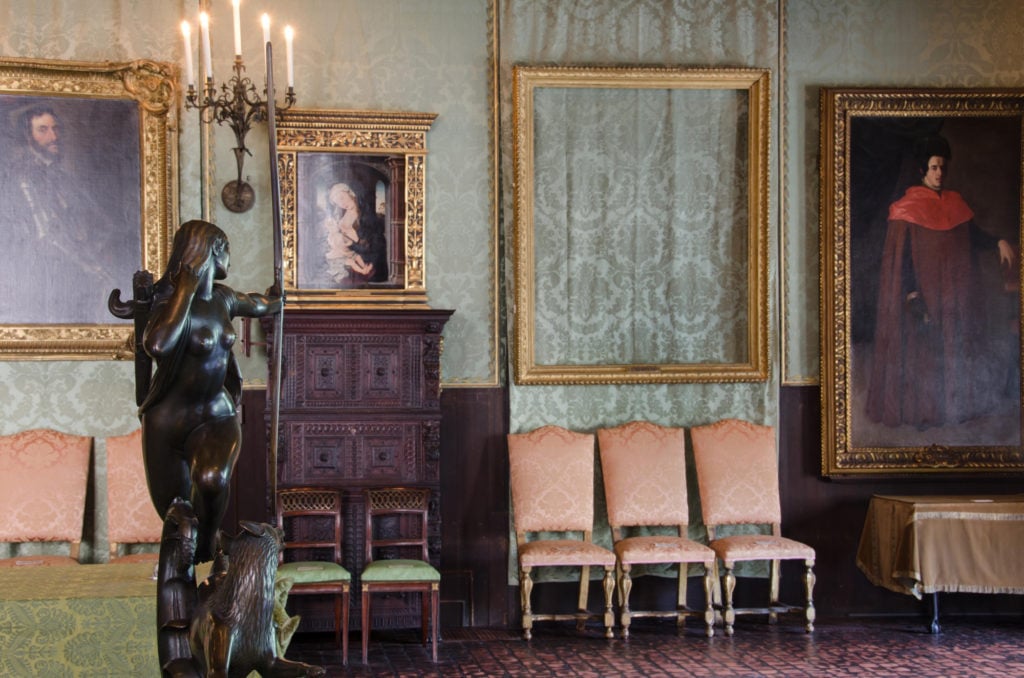 At the Isabella Stewart Gardner Museum, empty frames now hands in the Dutch Room in place of Rembrandt’s <em>The Storm on the Sea of Galilee</em> and <em>A Lady and Gentleman in Black</em>. Courtesy of the FBI. 
