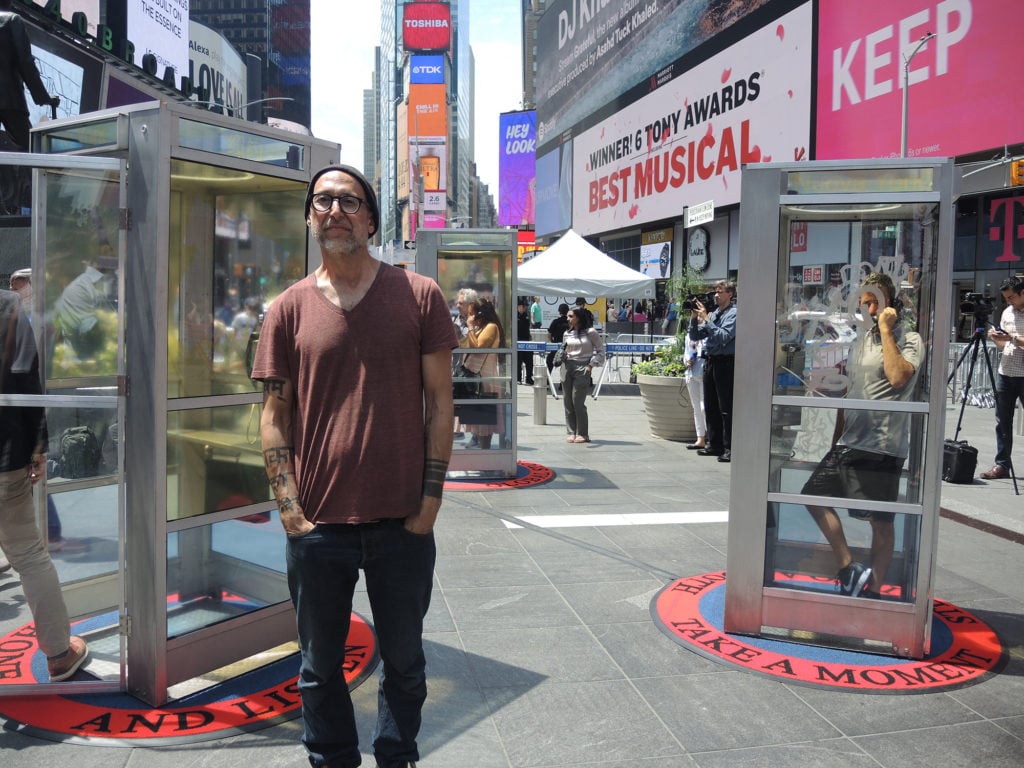 Aman Mojadidi in front of his installation <em>Once Upon a Place</em> in New York's Times Square. Courtesy of Sarah Cascone. 