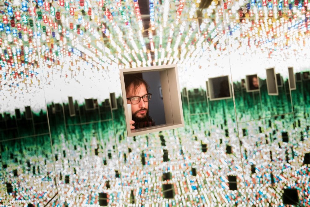 A man looks at the Love Forever room during a preview of the Yayoi Kusama's "Infinity Mirrors" exhibition at the Hirshhorn Museum (Courtesy of BRENDAN SMIALOWSKI/AFP/Getty Images)