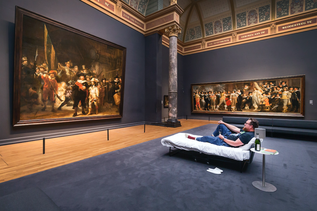 tefan Kasper from Haarlem enjoying his night at the Rijksmuseum in Amsterdam, under Rembrandt's <i>The Night Watch</i>. Photo courtesy Rijksmuseum.
