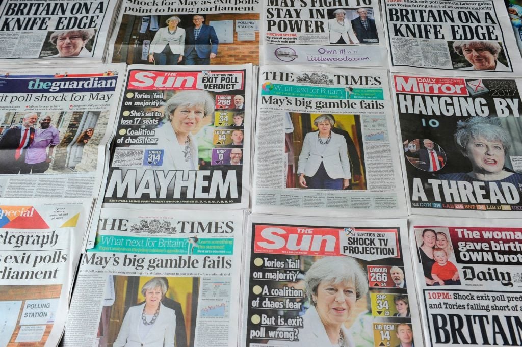 An arrangement of British daily newspapers are photographed as an illustration in London on June 9, 2017 showing front page stories about the exit poll results of the snap general election. Photo DANIEL SORABJI/AFP/Getty Images.