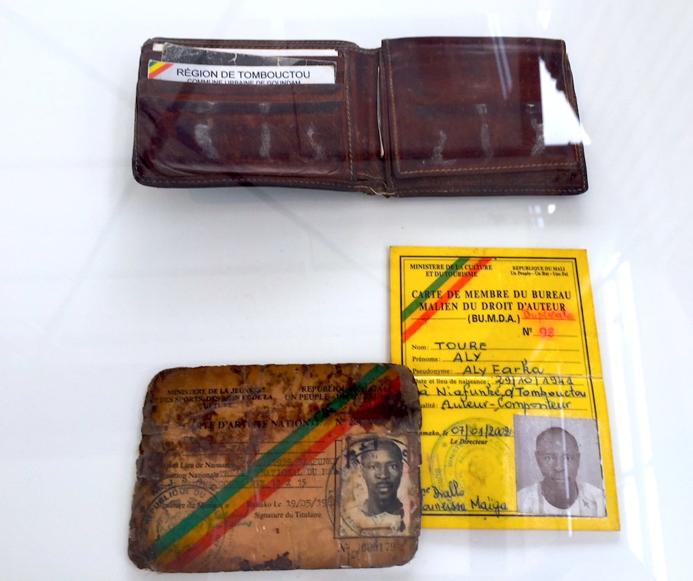 ID cards of Ali Ibrahim “Ali Farka” Touré, as displayed in documenta 14. Image: Ben Davis.