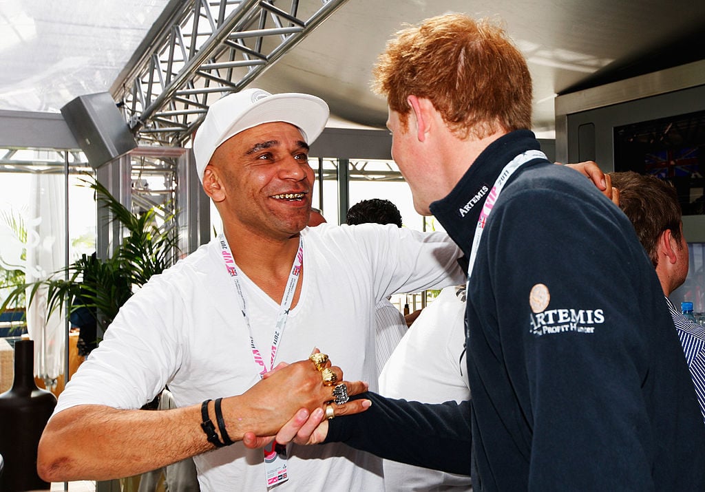 Prince Harry, right, meets musician Goldie in the Red Bull Racing Energy Station before the British Formula One Grand Prix at the Silverstone Circuit in 2011 in Northampton, England. Photo Mark Thompson/Getty Images.