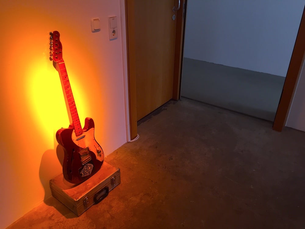 A guitar in the display dedicated to ID cards of Ali Ibrahim “Ali Farka” Touré, at documenta 14. Image: Ben Davis.