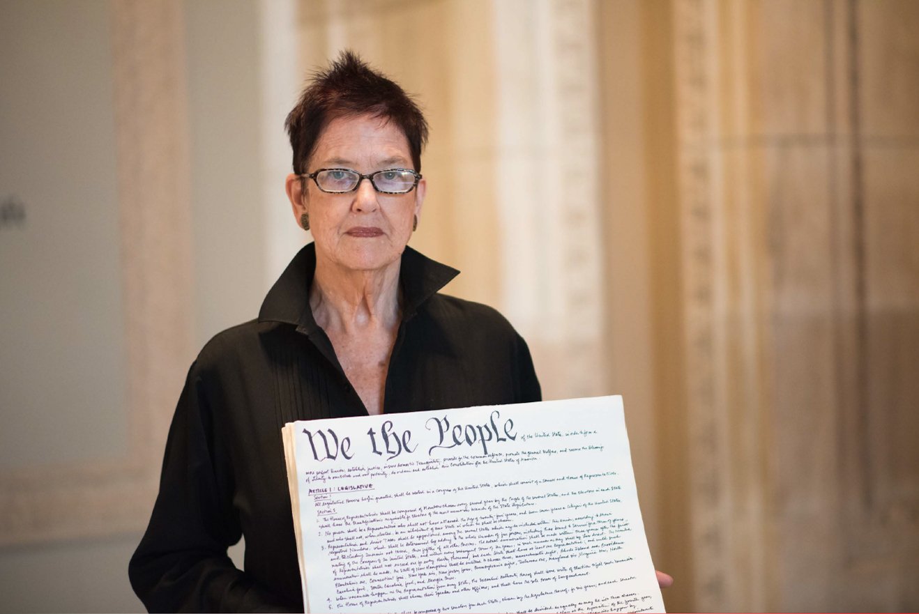 Morgan O'Hara with a handwritten copy of the Constitution made for her "Handwriting the Constitution" project. Courtesy of Marianne Barcellona.