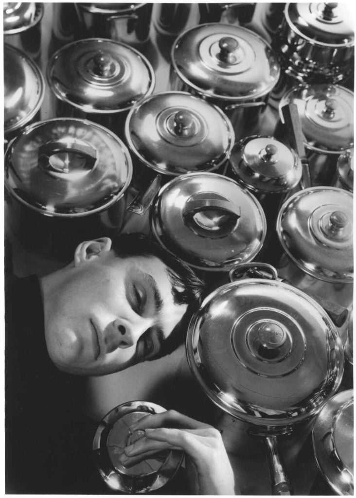 Max Dupain, self portrait, with saucepans, Bond Street Studio (circa early 1930s). Courtesy of the National Library of Australia.