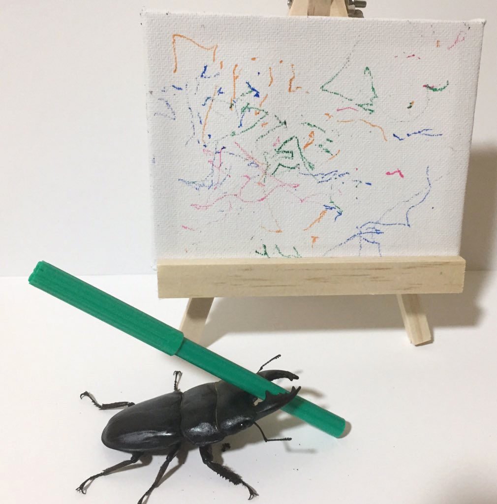 Spike the Beetle with his art. Courtesy of itmemandy via eBay.