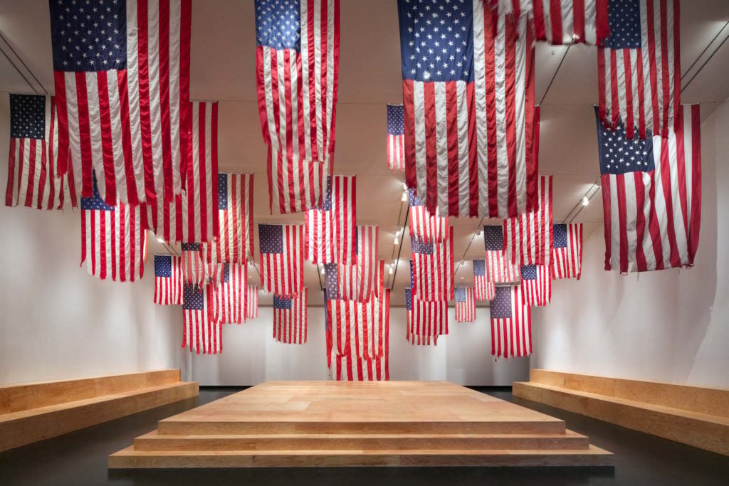 Mel Ziegler, <em>Flag Exchange</em> installation at the Tang Teaching Museum, Saratoga Springs, New York (2016). Courtesy of Arthur Evans. 