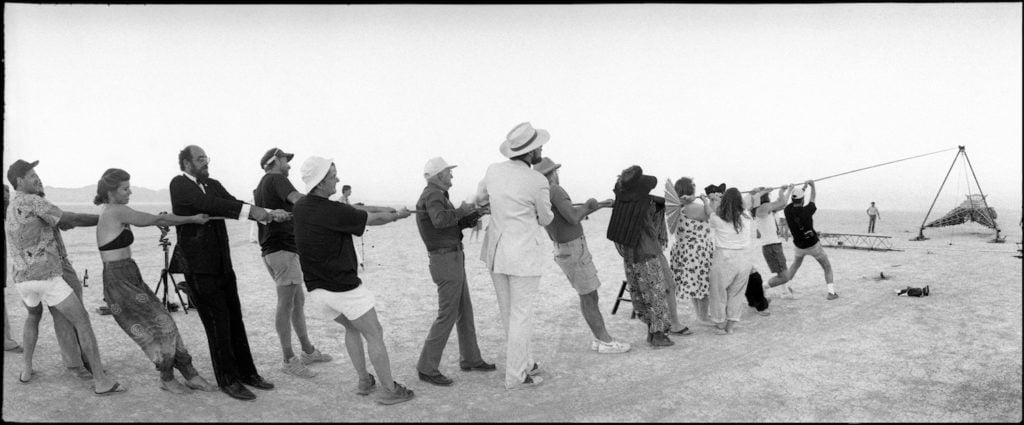 Stewart Harvey, the raising of the Burning Man in 1990, the first time the event took place in the Black Rock Desert. Courtesy of the Nevada Museum of Art. 