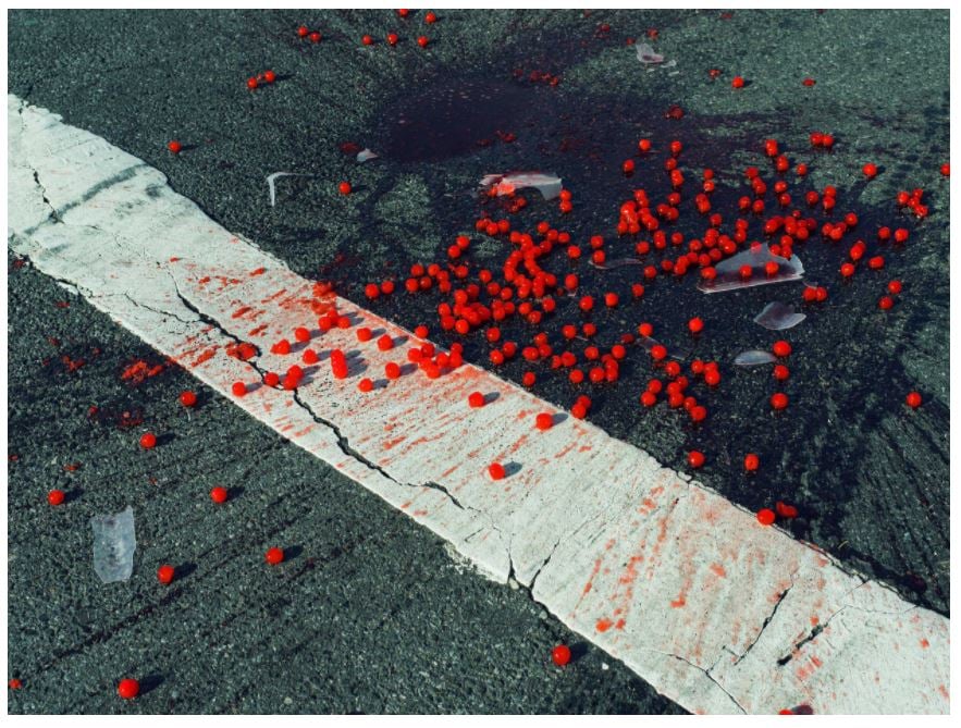 Christopher Anderson's <i>Cherries Spilled on Crosswalk, NYC, USA</i> (2014). © Christopher Anderson/ Magnum Photos. 