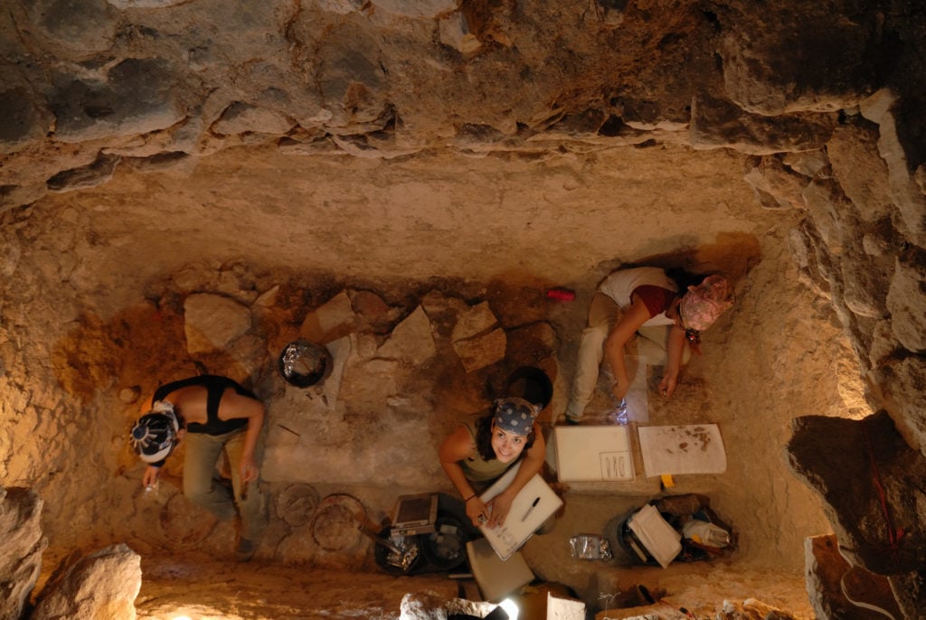 Excavation of Burial 39 at El Perú-Waka', Petén, Guatemala, Left to right: Jennifer Piehl, Michelle Rich, and Varinia Matute, Photo © Kenneth Garrett