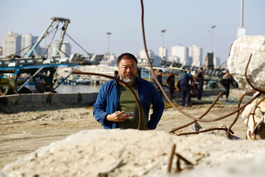 Chinese artist Ai Weiwei takes photos with his phone on May 12, 2016 at the port in Gaza City for his upcoming documentary film on the refugee crisis in the Middle East. Photo Mohammed Abed/AFP/Getty Images.