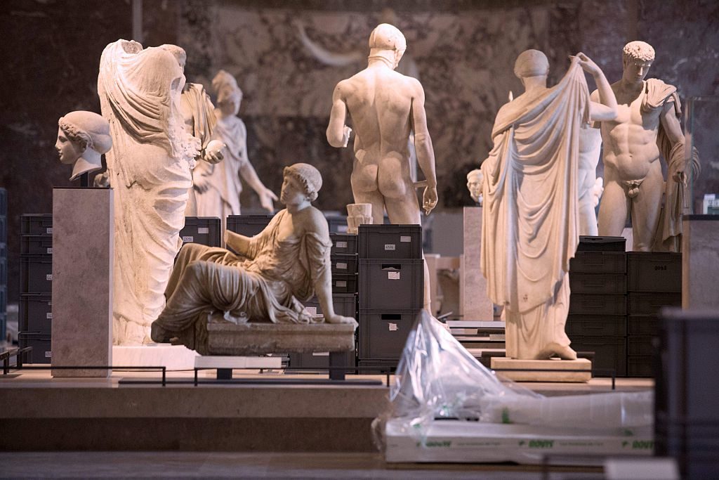 Valuable artworks from the Louvre reserves stored among statues after they were evacuated from the basement after rains brought the Seine to its highest level in three decades. Geoffrey van der Hasselt/AFP/Getty Images.