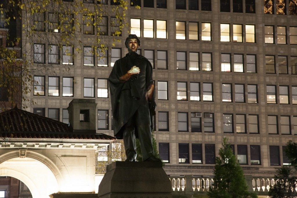 Krzysztof Wodiczko's <em>Abraham Lincoln: War Veteran Projection</em> (2012), a projection of the testimony of war veterans onto the Abraham Lincoln memorial in Union Square. Image courtesy More Art.