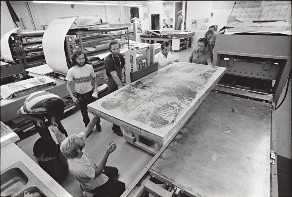 Rauschenberg overseeing the placement of the stone for <i>Waves</i> onto the press bed.
