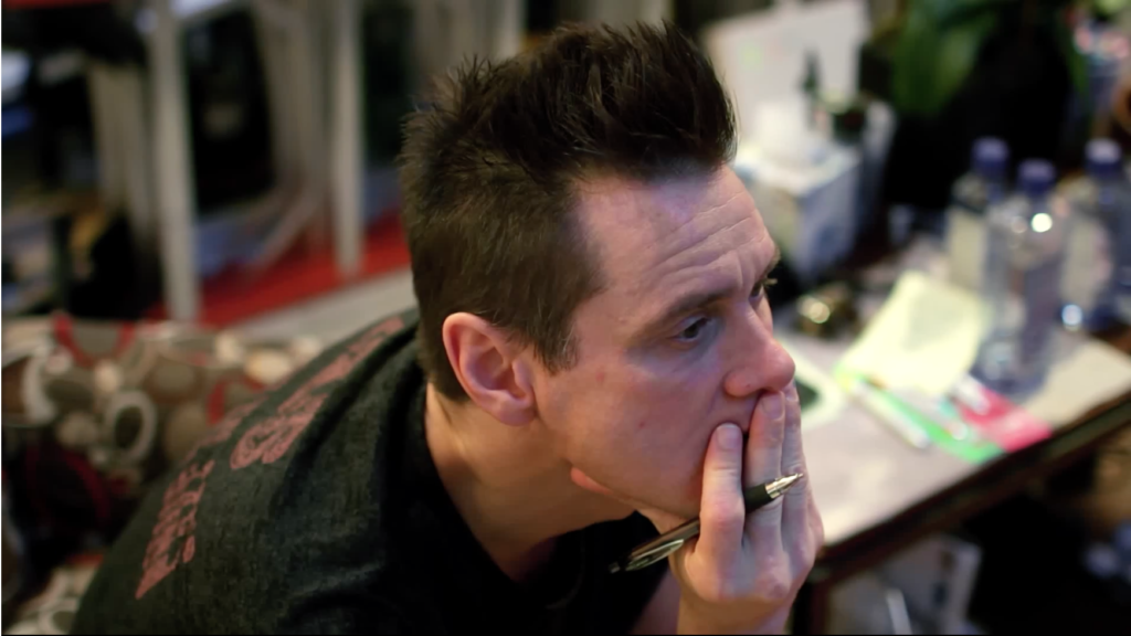 Jim Carey at work in his studio in the documentary I Need Color. Screenshot courtesy of Signature Gallery Group.